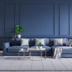 Nowoczesny salon z kanapą w kolorze petrol.
