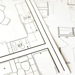 Plany architektoniczne z widocznym stołem, kuchnią (ST), łazienką (WC) i innymi pomieszczeniami. Dokumentacja do złożenia wniosku o pozwolenie na budowę.