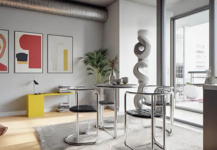 Nowoczesne wnętrze w stylu bauhaus: okrągły stolik z krzesłami, abstrakcyjne obrazy na ścianie, żółta konsola i duża rzeźba.