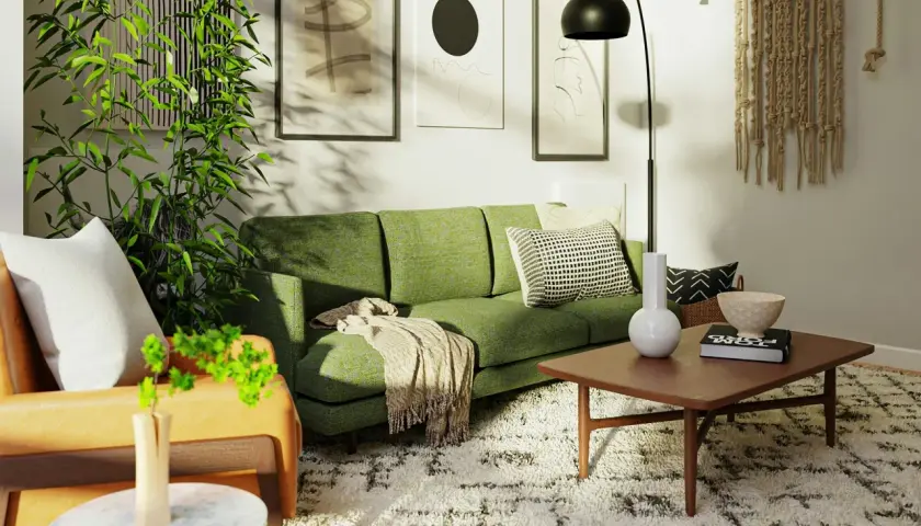 Zielona kanapa w salonie inspiracje: nowoczesny salon z zieloną kanapą, roślinami i sztuką na ścianach.