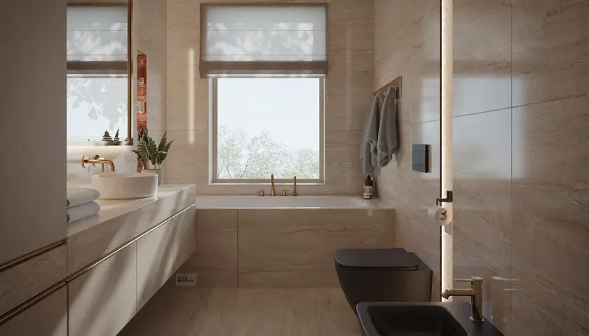 Nowoczesna łazienka z oknem na wprost drzwi, wanna, czarna miska WC i bidet, kamienne płytki, złote baterie.