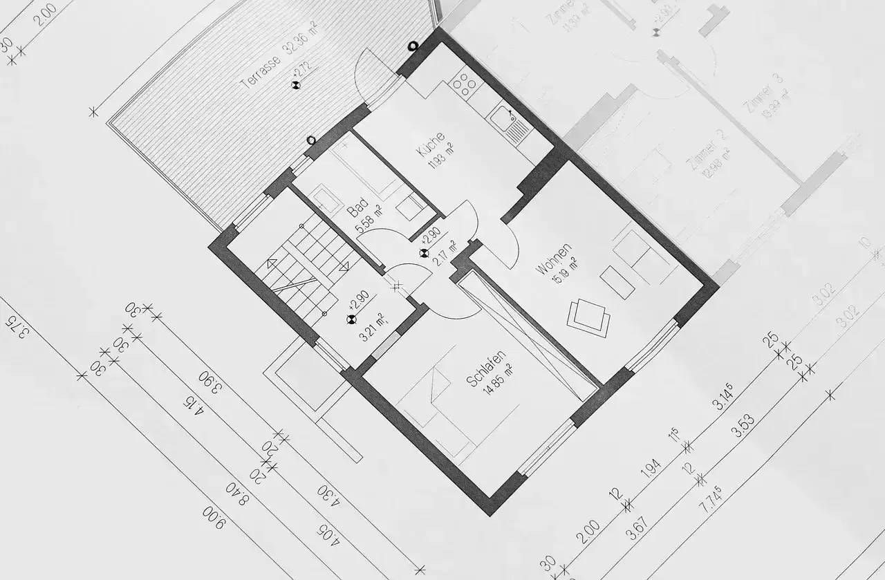 Plan parterowy bungalowu z kuchnią, łazienką, salonem i sypialnią. Widoczna duża terasa.